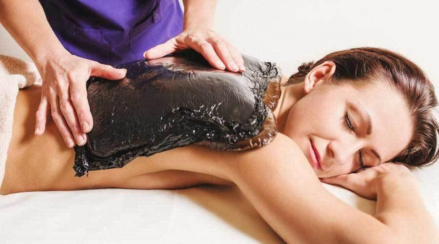 Лечение озокеритом: сущность процедур, показания и эффект